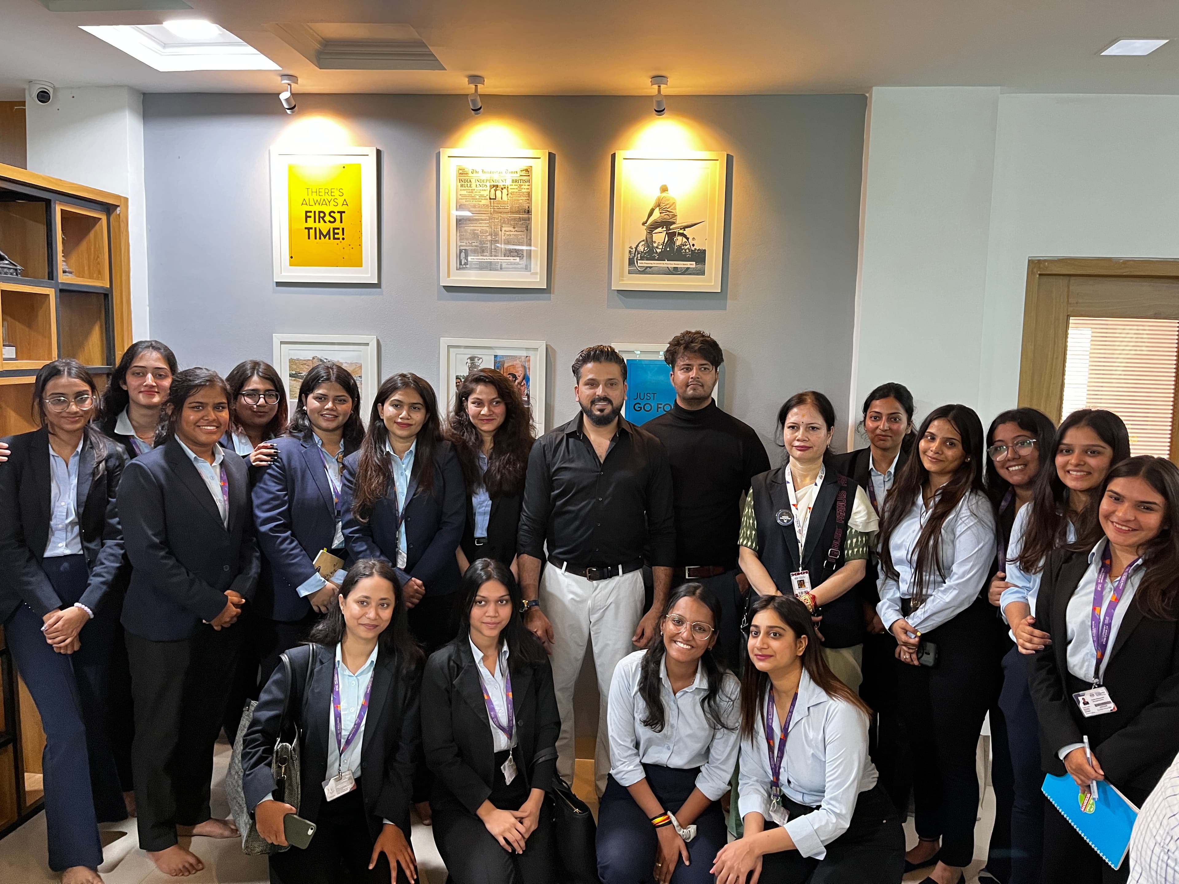 Lakeer Kukadia with student cohort in business blazers at university campus