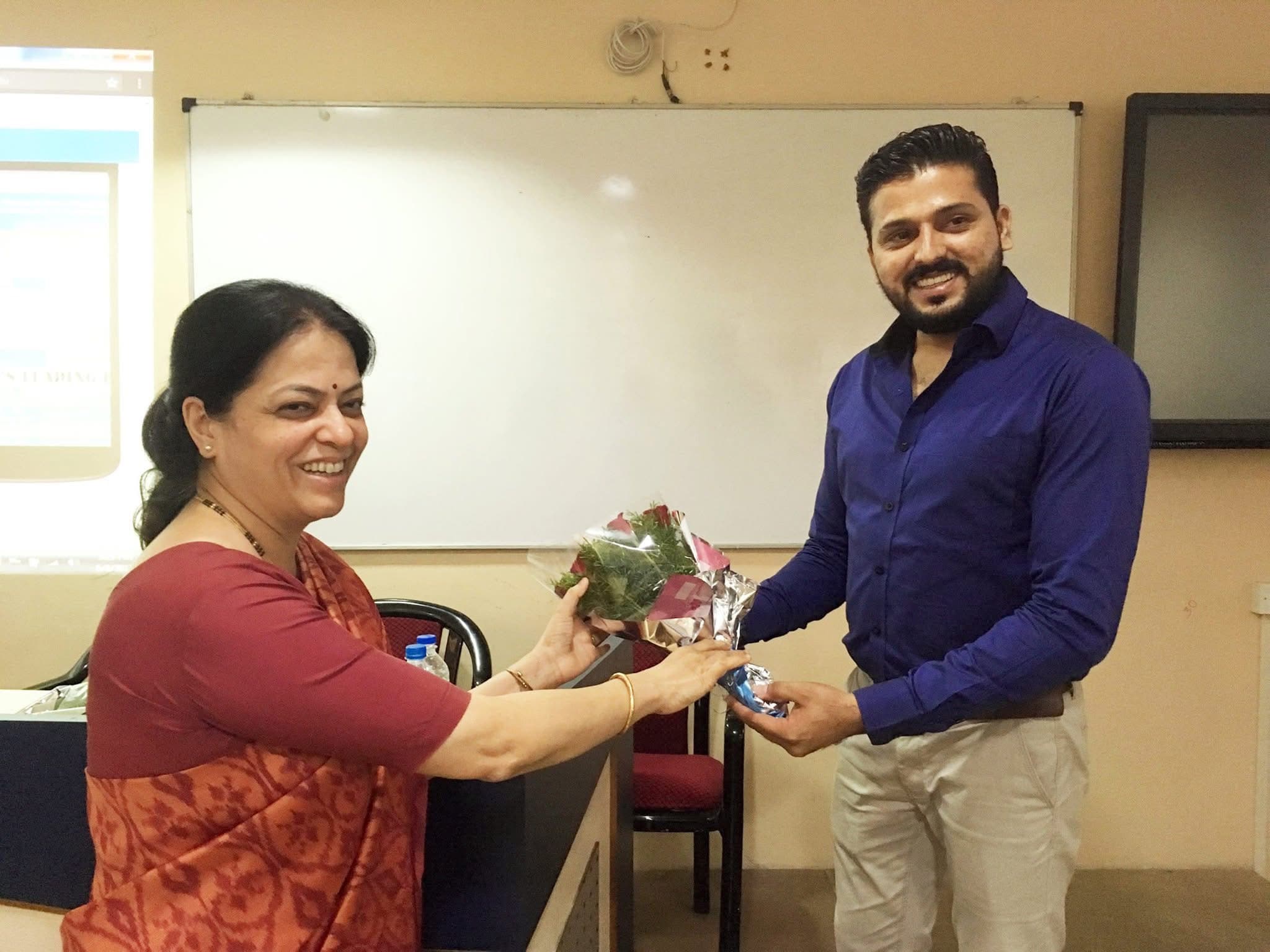 Lakeer Kukadia felicitated with bouquet at university guest lecture